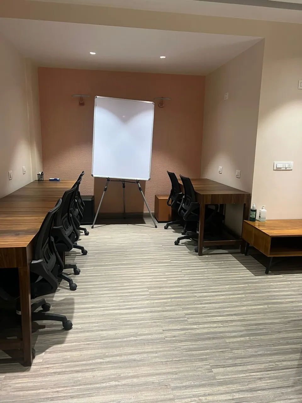 A private office cabin with desks and a whiteboard at CollaboCorner, Jaipur